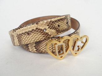 Vente aux enchères DOLCE   GABBANA. Ceinture en python, boucle en métal doré et strass