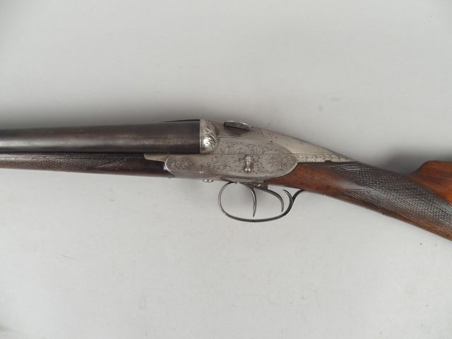 74-  Fusil juxtaposé CHARLIN à canons fixes (4 lièvres). Calibre 12/65