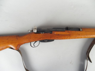 Vente aux enchères 142- Fusil Suisse réglementaire K31 calibre 30/284W avec son magasin a