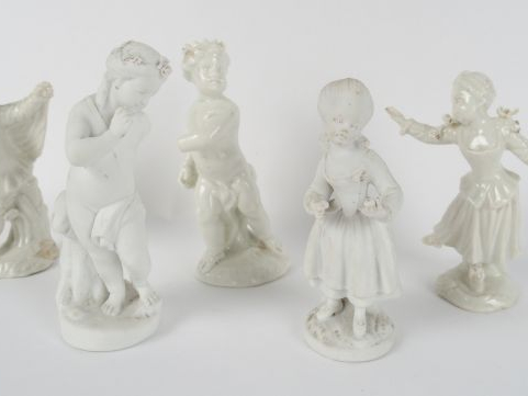 Deux différentes statuettes en biscuit 'Amour' et 'Fillette' (accident
