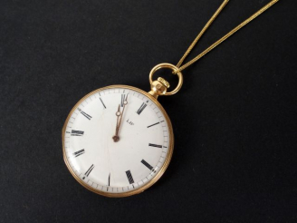 Vente aux enchères LIP. Montre de gousset et sa chaîne en or jaune, cadran émail. Poids t