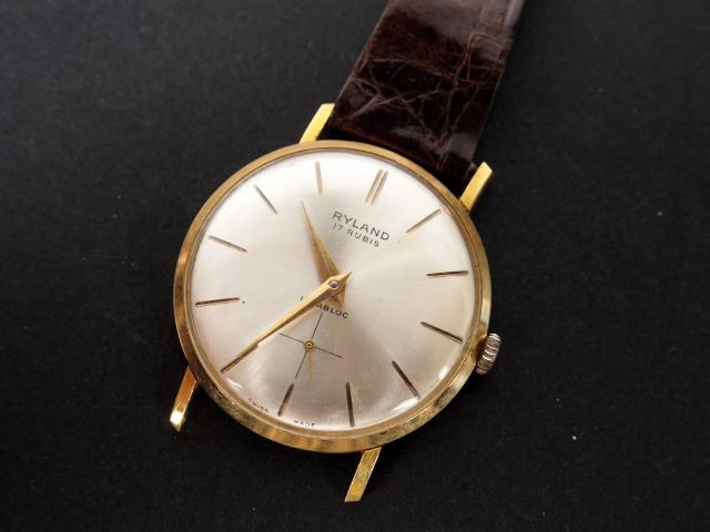 RYLAND. Boitier de montre rond en or jaune. Poids tel: 21gr