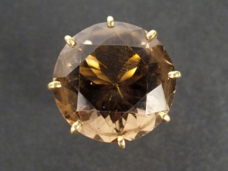 Vente aux enchères Bague 1960 monture or jane, ornée d'un quartz fumé taille brillant de 