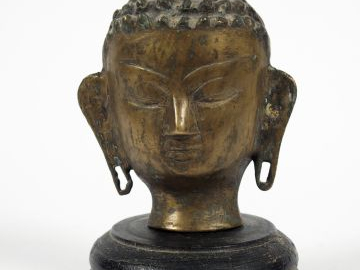 Tête de Bouddha. Copie. XXe siècle H. 12,5 cm