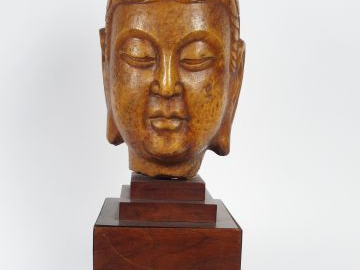 Sculpture en marbre patiné représentant une tête de Bouddha. Chine, XX