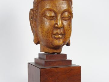 Sculpture en marbre patiné représentant une tête de Bouddha. Chine, XX