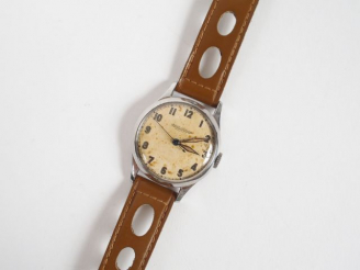 Vente aux enchères JAEGER LECOULTRE. Montre d'homme, boitier rond acier, circa 1950 (fond