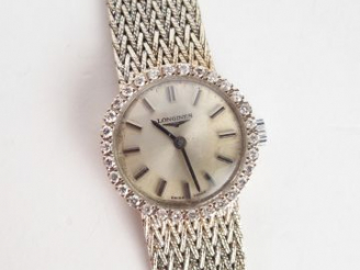 Vente aux enchères LONGINES. Montre de dame, boitier et bracelet semi rigide tressé en or