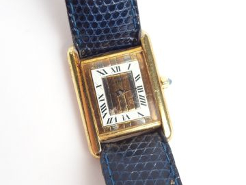 CARTIER. Montre "Tank" dame en vermeil, argent et plaqué or, bracelet 