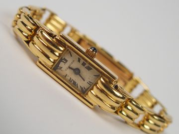 CARTIER. Montre de dame, boitier et bracelet en or jaune. Signée et nu