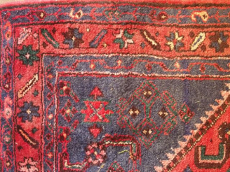 Vente aux enchères Tapis d'Orient fond rouge