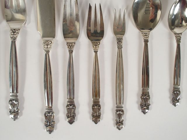 	Georg JANSEN. Ménagère en argent, modèle Acorn comprenant : - 9 grand