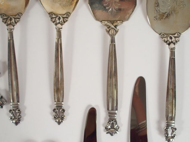 	Georg JANSEN. Ménagère en argent, modèle Acorn comprenant : - 9 grand