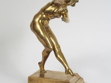 COLINET. Sculpture en bronze doré « Danseuse ». Socle en onyx. H. : 33