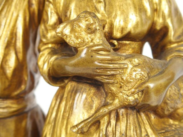 J. d’ASTE. Sculpture en bronze à patine dorée, "Couple de paysans et l