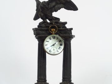 Porte-montre et montre loupe fin XIXème en bronze patiné, à décor d'ai