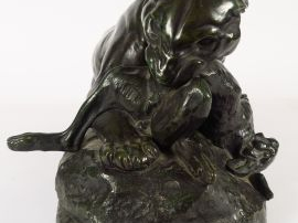 Antoine Louis BARYE. 'Tigre dévorant un lièvre'. Sujet en bronze à pat