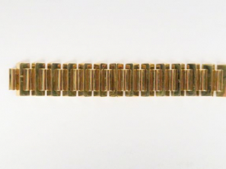 Vente aux enchères Bracelet tank en or. 94 g