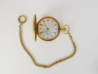 Vente aux enchères Montre savonnette en or et sa giletière (poids de la giletière 30 g). 