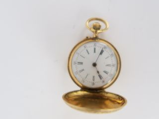 Montre de col en or. 14 g tel