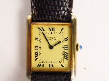 CARTIER. Montre modèle Must, cadran en vermeil