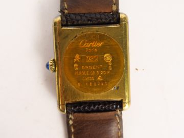 CARTIER. Montre modèle Must, cadran en vermeil