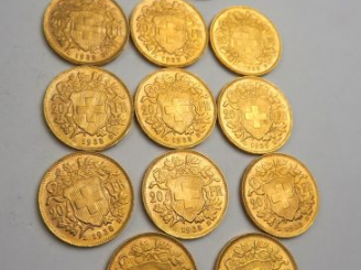 Vente aux enchères 12 pièces de 20 francs Suisse or (11 x 1935 B, 1 x 1947 B). Frais ache
