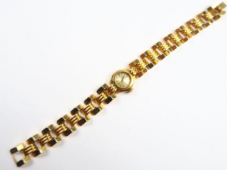 Vente aux enchères Montre Art Déco de marque Unic, boitier et bracelet en or. Poids tel :