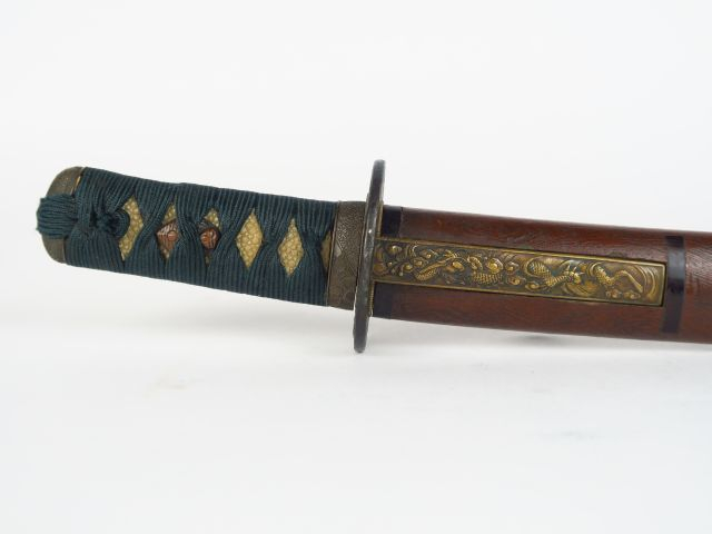 Tanto, fourreau en laque à l'imitation du bois. Japon, XIXème. L. tota