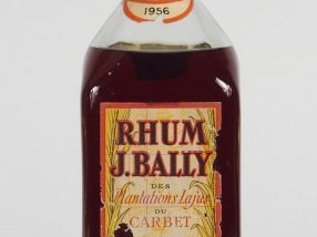 Vente aux enchères 1 BOUTEILLE RHUM J. BAILLY - 1956 - EA/CAPS TL CORRODEE