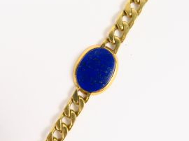 Vente aux enchères Bracelet maille gourmette et médaillon en lapis lazuli. Poids tel : 33
