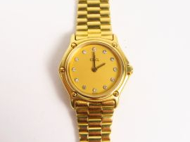 Vente aux enchères EBEL. Montre de dame, boitier et bracelet or, cadran orné de 12 brilla