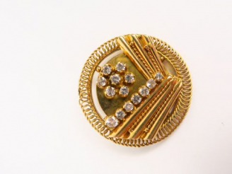 Vente aux enchères Broche de style Art déco en or et pierres à l'imitation du diamant.  1