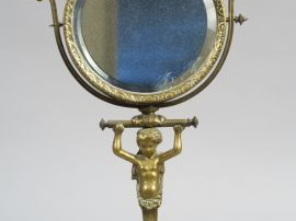 Vente aux enchères Miroir de toilette en bronze, à décor de jeune atlante, socle en marbr