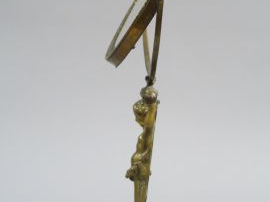 Miroir de toilette en bronze, à décor de jeune atlante, socle en marbr