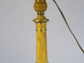 	Un bougeoir XIX ème en laiton doré