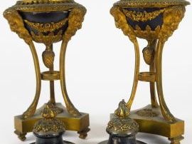 Paire d'athéniennes de style Empire en bronze patiné et doré à décor d