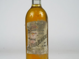 Vente aux enchères 1 BOUTEILLE CHÂTEAU LA TOUR BLANCHE 1er CC SAUTERNES - 1957 - BG+/EA/B