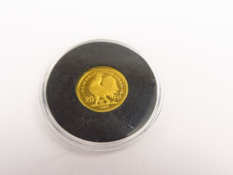 Réduction de pièce de 20 frcs en or. Poids : 1,2 g