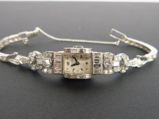 Vente aux enchères HAMILTON. Montre de dame Art Déco en or 14 carats, boitier et bracelet