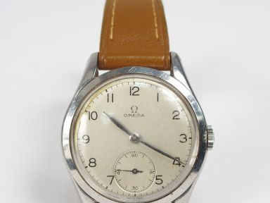 OMEGA. Montre d'homme, boitier rond en acier fond acier brossé, chiffr