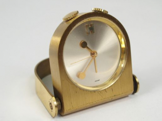 Vente aux enchères HERMES. Pendulette de poche en laiton, fond acier brossé, monogrammé H