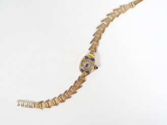 Vente aux enchères Montre de dame en plaqué or, boitier ovale rehaussé de d'émail bleue e