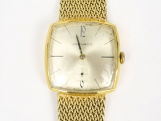 Vente aux enchères MOVADO. Montre, cadran en or 18 carats, bracelet en or 14 carats. Poid