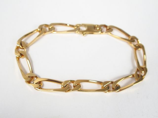 Gourmette en or jaune, maille alternée. 18cm Poids: 17,4gr