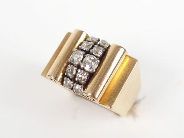 Bague 1940-1950 dite "pont" en or jaune, motif central en 2 lignes de 