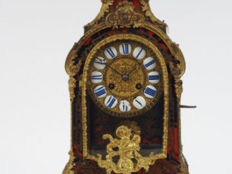 Vente aux enchères Cartel Napoléon III de style Régence en marqueterie Boulle, écaille ro