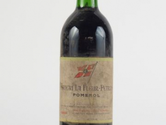 Vente aux enchères 1 BOUTEILLE CHÂTEAU LA FLEUR PETRUS POMEROL - 1985 - BG/E POUSSIEREUSE