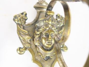 Paire d'appliques XVIIIème en bronze à décor de visage de jeune fille 