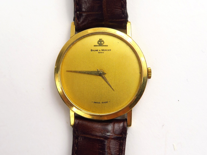 BAUME ET MERCIER. Montre d'homme, boitier en or, bracelet en cuir non 